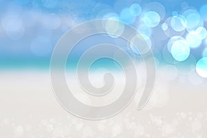 Abstract sea background. Abstract sandy summer beach background with bokeh lights on light blue sky. Beautiful texture. Space photo