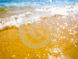 Abstract sea background. Abstract sandy summer beach background with bokeh lights on light blue sky. Beautiful texture. Space