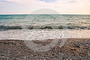 Abstract sea background. Sea waves on a sandy beach. Water surface background