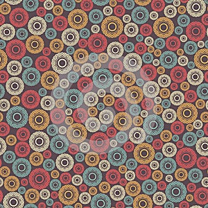 Abstract seamless pattern, background. Uniformly distributed disjoint geometric elements of different sizes. Colored rings with a