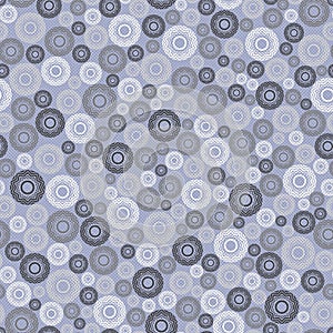 Abstract seamless pattern, background. Uniformly distributed disjoint geometric elements of different sizes. Colored rings with a