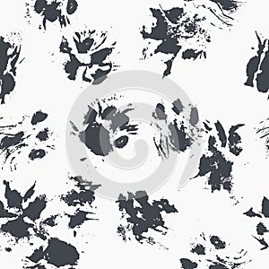 Abstract seamless pattern - black ink prints with messy cat paws.