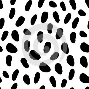 Abstract seamless pattern with black spots on white. Dalmatian skin imitation. Animal print. Vector illustration