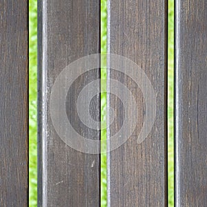 Seamless photo texture of warm lumber dack and grass