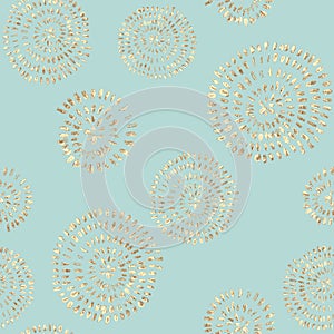 Abstract seamless pattern with golden glittering acrylic paint round spiral circles on pastel green background
