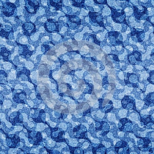 Abstract seamless pattern. Repeating fades blue denim background prints. Repeated faded distress circle jean fabric. Chambray photo
