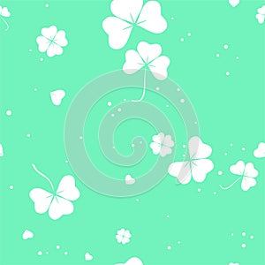 Abstract seamless pattern with white clover leafs on green background