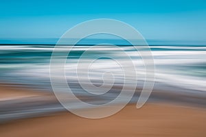 Abstract seascape background. Sandy beach and clear blue sky.