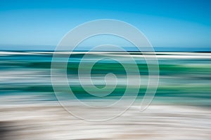 Abstract seascape with blurred panning motion, blue and turquoise colors photo