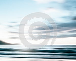 An abstract seascape with blurred panning motion on paper background