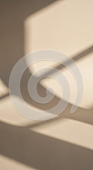 Abstract shadows on a beige surface create a dynamic pattern. Soft, curved and