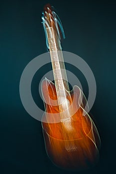 Abstract shape of guitar on dark background