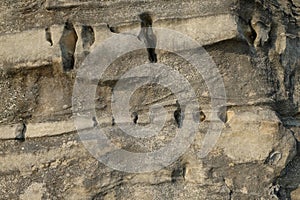 Abstract shapes, patterns and textures of limestone surface with holes