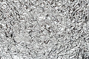 Abstract shiny crumpled silver metal chrome aluminum foil background texture
