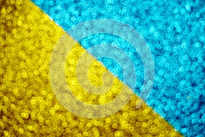 Abstract shiny sparkle yellow and blue glitter bokeh background