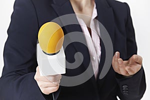 Abstract Shot Of Female Journalist With Microphone