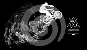 Abstract silhouette of a bmx rider on the dark, black background from particles. Bmx rider jumps and performs the trick.