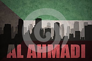 Abstract silhouette of the city with text Al Ahmadi at the vintage kuwait flag photo