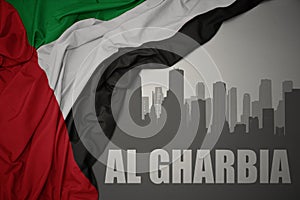 Abstract silhouette of the city with text Al Gharbia near waving national flag of united arab emirates on a gray background