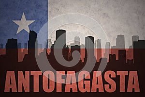 Abstract silhouette of the city with text Antofagasta at the vintage chilean flag