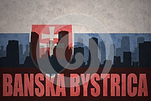 Abstract silhouette of the city with text Banska Bystrica at the vintage slovakia flag