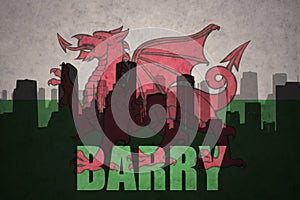 Abstract silhouette of the city with text Barry at the vintage wales flag