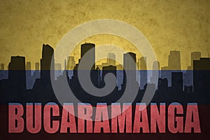 Abstract silhouette of the city with text Bucaramanga at the vintage colombian flag photo