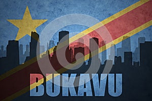 Abstract silhouette of the city with text Bukavu at the vintage democratic republic of the congo flag