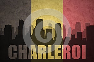 Abstract silhouette of the city with text Charleroi at the vintage belgian flag