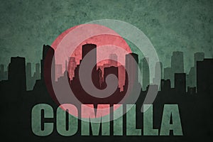Abstract silhouette of the city with text Comilla at the vintage bangladesh flag