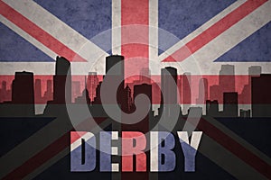 Abstract silhouette of the city with text Derby at the vintage british flag