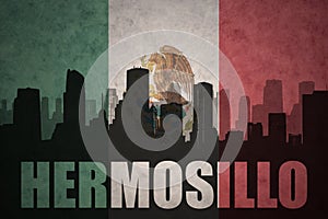 Abstract silhouette of the city with text Hermosillo at the vintage mexican flag photo