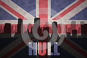 Abstract silhouette of the city with text Hull at the vintage british flag