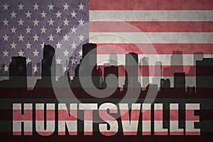 Abstract silhouette of the city with text Huntsville at the vintage american flag
