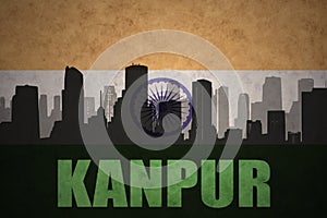 Abstract silhouette of the city with text Kanpur at the vintage indian flag