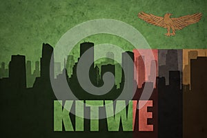 Abstract silhouette of the city with text Kitwe at the vintage zambian flag