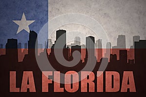 Abstract silhouette of the city with text La Florida at the vintage chilean flag