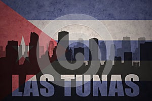 Abstract silhouette of the city with text Las Tunas at the vintage cuban flag