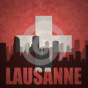 Abstract silhouette of the city with text Lausanne at the vintage swiss flag