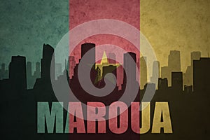 Abstract silhouette of the city with text Maroua at the vintage cameroon flag