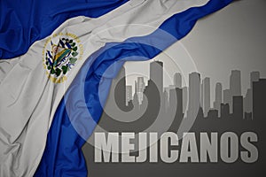 Abstract silhouette of the city with text Mejicanos near waving national flag of el salvador on a gray background. 3D illustration photo