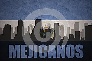 Abstract silhouette of the city with text Mejicanos at the vintage salvadoran flag