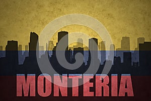 Abstract silhouette of the city with text Monteria at the vintage colombian flag photo
