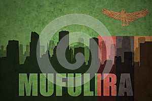 Abstract silhouette of the city with text Mufulira at the vintage zambian flag