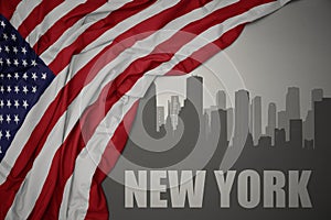 Abstract silhouette of the city with text New York near waving national flag of united states of america on a gray background