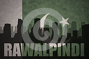 Abstract silhouette of the city with text Rawalpindi at the vintage pakistan flag