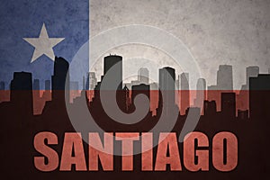 Abstract silhouette of the city with text Santiago at the vintage chilean flag