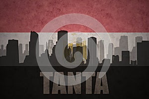 Abstract silhouette of the city with text Tanta at the vintage egyptian flag