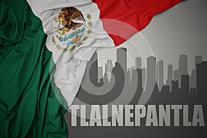 Abstract silhouette of the city with text Tlalnepantla near waving national flag of mexico on a gray background photo