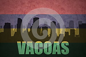 Abstract silhouette of the city with text Vacoas at the vintage mauritius flag